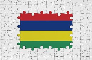 Mauritius flag in frame of white puzzle pieces with missing central part photo