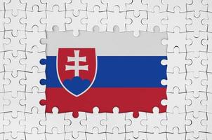 Slovakia flag in frame of white puzzle pieces with missing central part photo