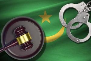 Mauritania flag with judge mallet and handcuffs in dark room. Concept of criminal and punishment, background for judgement topics photo