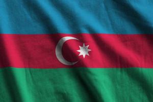 Azerbaijan flag with big folds waving close up under the studio light indoors. The official symbols and colors in banner photo