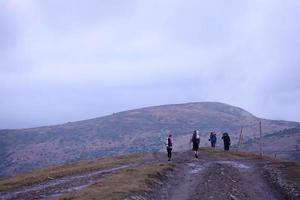 CARPATHIAN MOUNTAINS, UKRAINE - OCTOBER 8, 2022 Mount Dragobrat. Carpathians in Ukraine in foggy day photo