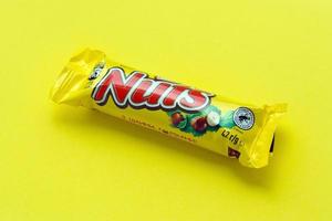 KYIV, UKRAINE - MAY 4, 2022 Nuts original chocolate bar manufactured by Nestle company photo