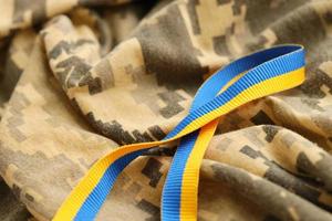 Pixeled digital military camouflage fabric with ribbon photo