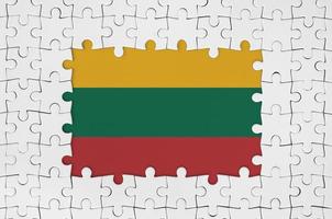 Lithuania flag in frame of white puzzle pieces with missing central part photo