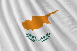 Cyprus flag with big folds waving close up under the studio light indoors. The official symbols and colors in banner photo