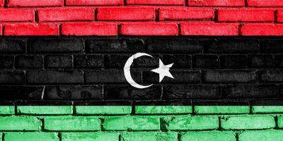 Flag of Libya on a textured background. Concept collage. photo