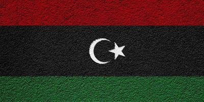 Flag of Libya on a textured background. Concept collage. photo