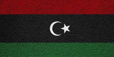 Flag of Libya on a textured background. Concept collage. photo