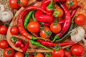 Food ingredients of the mediterranean diet and healthy eating. Vegetables, herbs and spices on a wooden board, fresh produce from a farmer's market photo