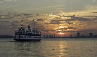 A passenger ferry on Lake Ontario near Toronto at sunset. photo