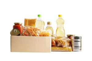 Foodstuffs in donation box isolated on white background with clipping path for volunteer to help people. photo