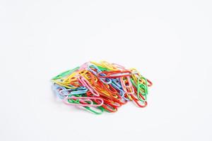 Paper clips colorful isolated on white background, office equipment. photo