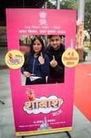 New Delhi, India - December 04 2022 - Unidentified people showing their ink-marked fingers after casting votes in front of polling booth of east Delhi area for MCD local body Elections 2022 photo