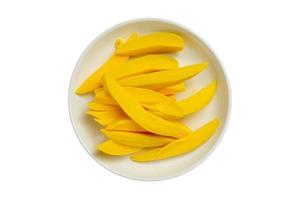 3300 Slices of mango on a white bowl isolated on a transparent background photo