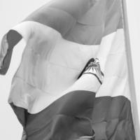 India flag flying high at Connaught Place with pride in blue sky, India flag fluttering, Indian Flag on Independence Day and Republic Day of India, tilt up shot, Waving Indian flag, Har Ghar Tiranga photo