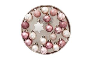 7043 Pink christmas ball on a gold plate isolated on a transparent background photo