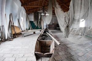 handmade old fishing net inside fisherman house photo