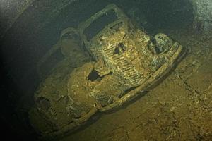 Old Car inside II world war ship wreck hold photo