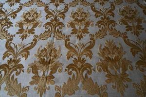 medieval fabric texture background gold and white photo