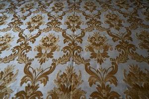 medieval fabric texture background gold and white photo