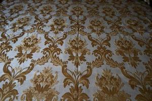 medieval fabric texture background gold and white photo