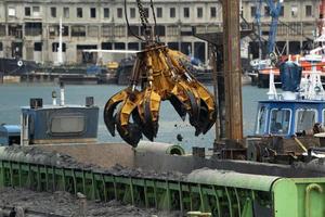 Harbor port dredge working on sea photo