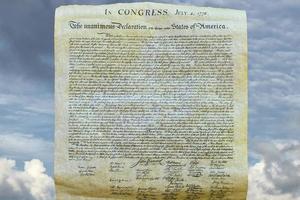 Declaration of independence 4th july 1776 on sky background photo