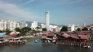 Aerial view fly towards wooden bridge at seashore at Georgetown Penang. video