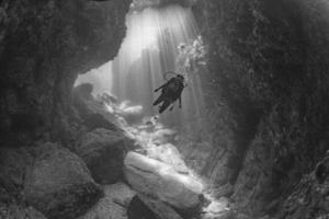 Beaytiful Latina Diver Inside a canyon photo