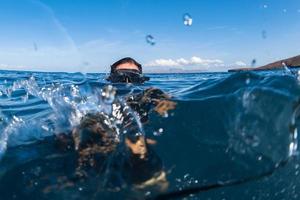 Beaytiful Latina Diver on sea surface photo