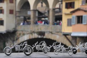 Florence Ponte Vecchio view with toy motorbike photo