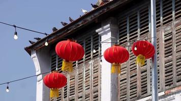 Red chinese lantern hang outdoor of wood window video