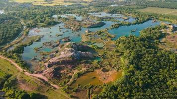 Aerial hyperlapse over green abandoned quarry lake video