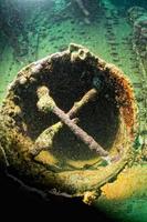 porthole of umbria ship wreck in red sea photo