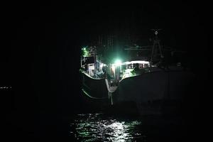 maldivian fishing boat in maldives at night photo