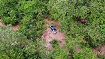Aerial view a car is trap in mud video