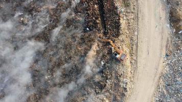 Aerial look down excavator try to save the fire video