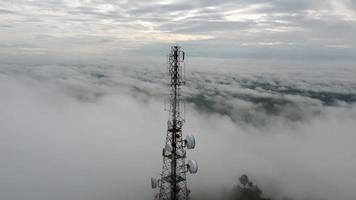 Aerial tracking rotate follow the telecommunications tower video