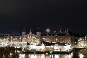 amsterdam central station at night cityscape photo