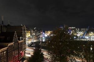 amsterdam central station at night cityscape photo