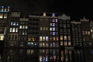 amsterdam canals cruise at night photo