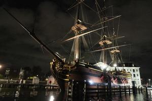 amsterdam canal vessel ship museum at night photo