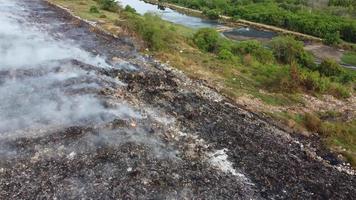 Landfill site garbage is burn and release smoke video