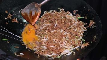 Egg is put into the Char Kuey Teow street food video