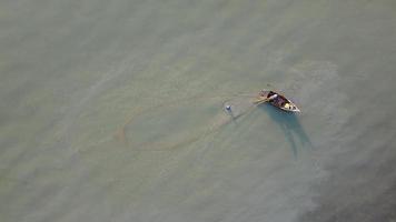 Aerial top down view two fisherman casting net video