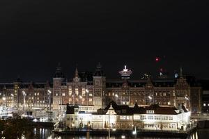 amsterdam central station at night cityscape photo