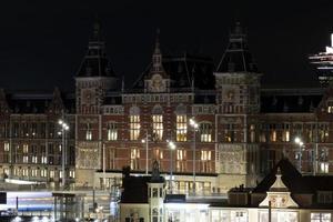 amsterdam central station at night cityscape photo