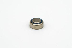 Button battery macro isolated on white photo