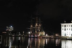 amsterdam canal vessel ship museum at night photo