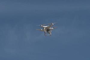 Drone isolated in blue sky photo